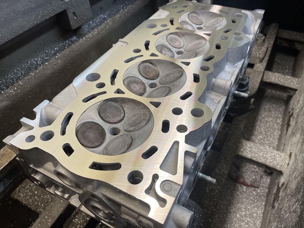 Diesel cylinder head on bench during overhaul
